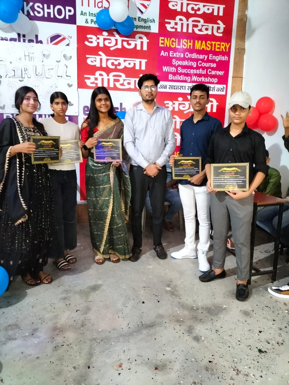 Students receiving certificates at the farewell